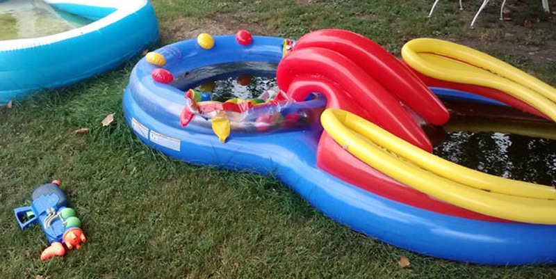 Neglected and dirty kids swimming pool in yard